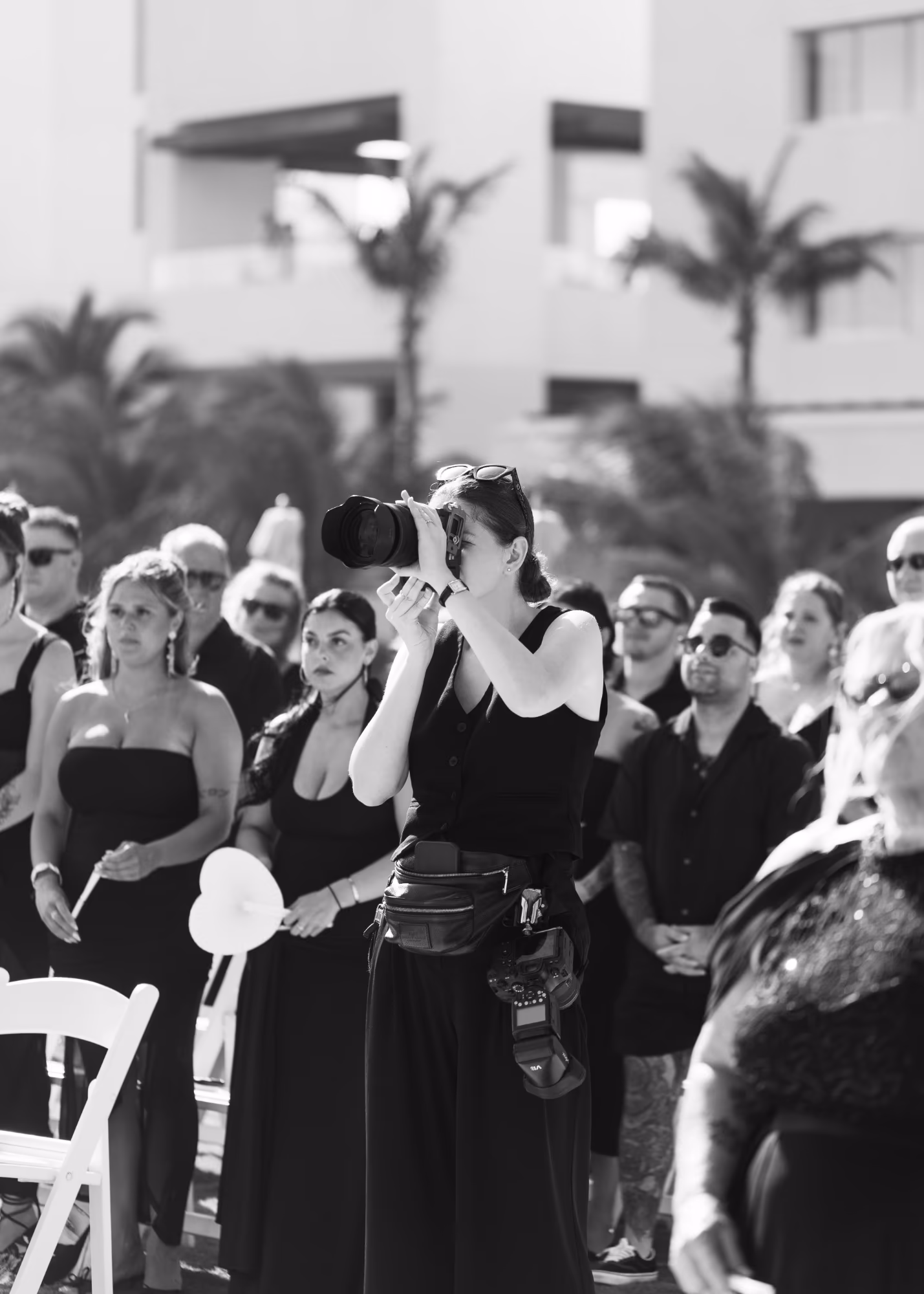 Kristina photographing a ceremony from among the guests