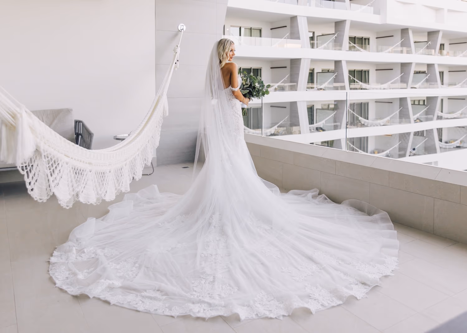 Stunning bride showcasing her pristine white wedding dress at Garza Blanca Cancun